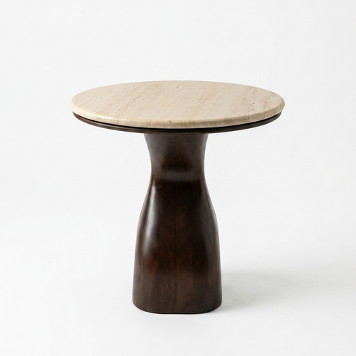 A modern side table featuring a round, light beige travertine stone top and a sculptural, tapered dark brown wooden base, photographed on a seamless white background.
