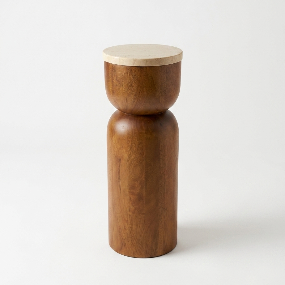 A minimalist wooden side table or pedestal with a cylindrical base and a round travertine top, featuring a mango wood finish and a contrasting light beige wood lid, set against a plain white background.