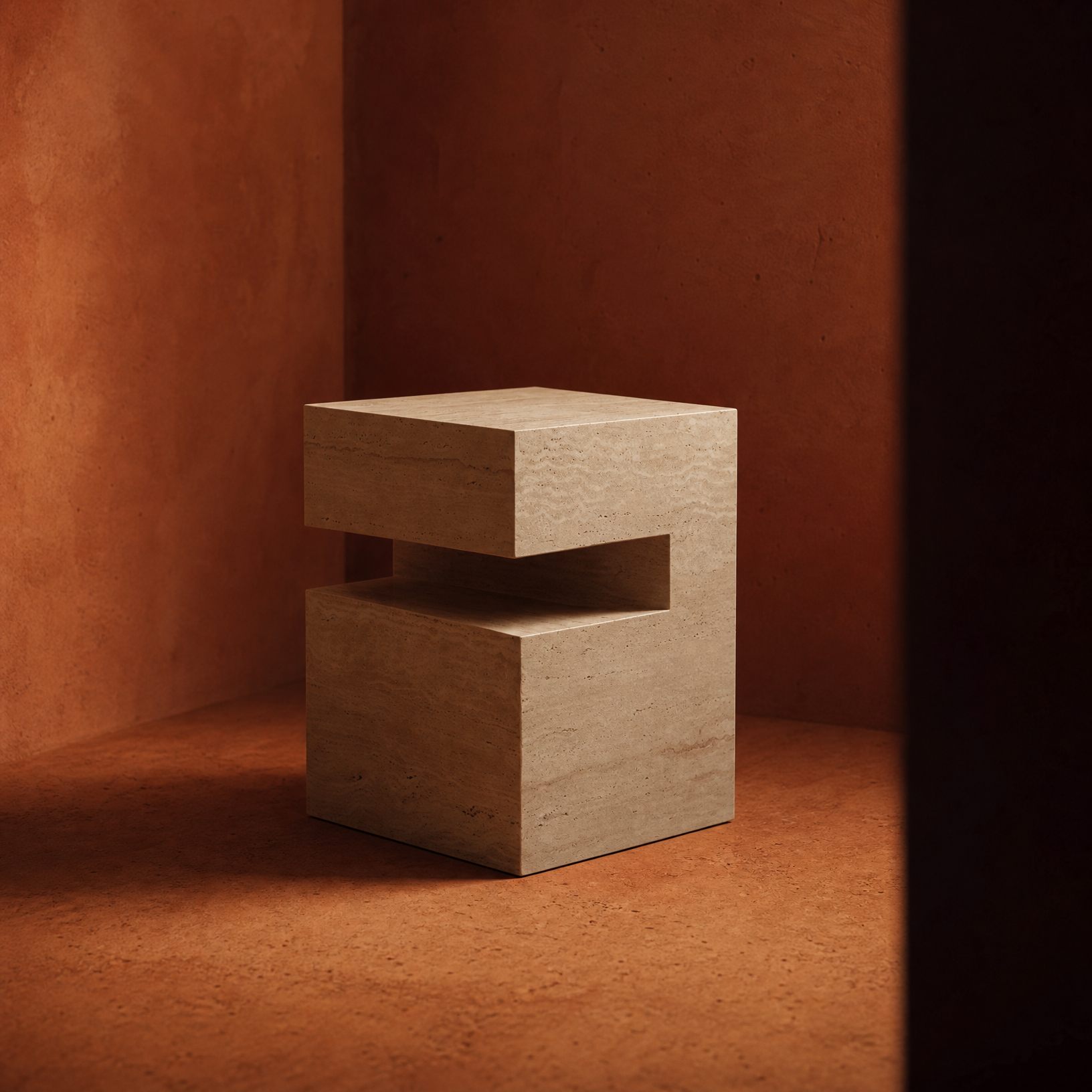A modern, geometric travertine side table with a stacked block design and a central cutout, set against a warm terracotta textured background.