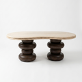 A modern wooden coffee table with a light beige curved travertine top and dark brown stacked round legs, photographed against a clean white background.