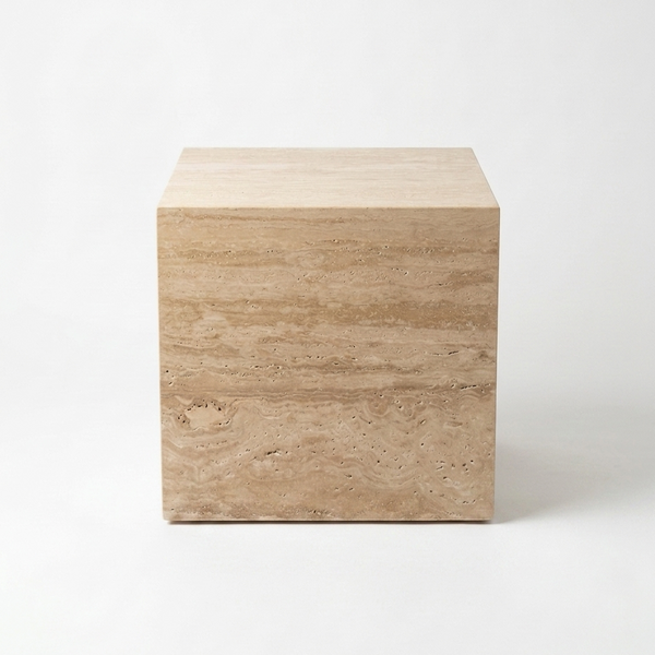 A square side table made of natural travertine stone with a light beige and tan layered texture, photographed on a seamless white background.