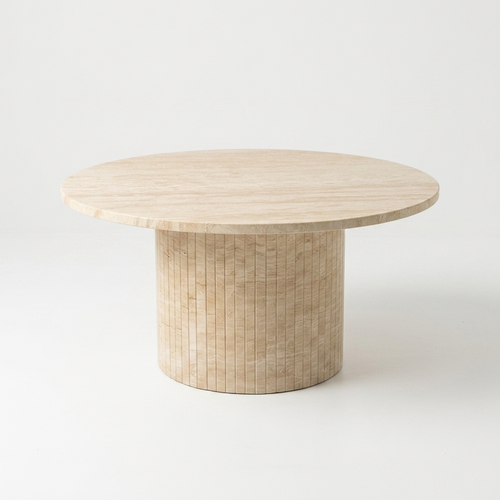 A round coffee table with a light beige travertine top and a cylindrical pedestal base made of travertine, shown on a seamless white background.