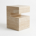 A modern geometric side table made of light beige travertine stone, featuring a stepped, block-like design on a clean white background.